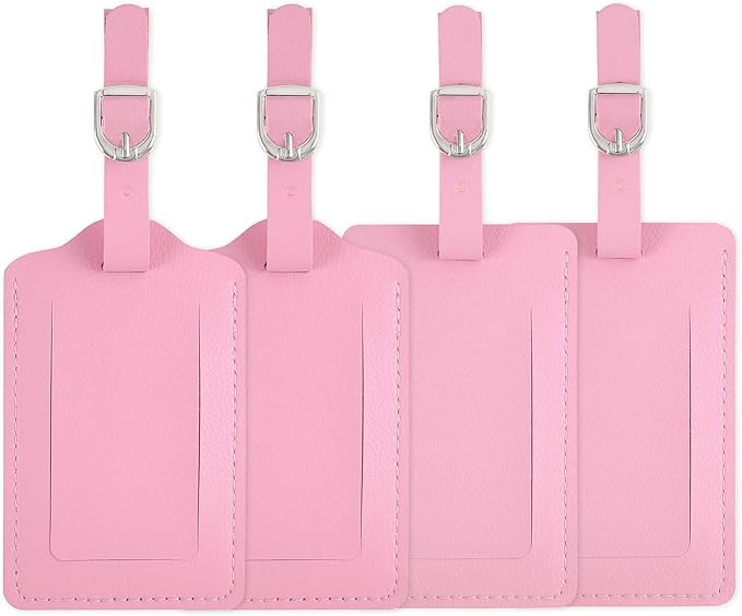 Set of four pink luggage tags with straps on a white background