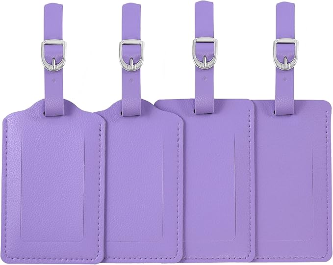 Four purple luggage tags with silver buckles on a white background