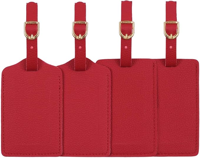 Four red luggage tags with gold buckles on a white background