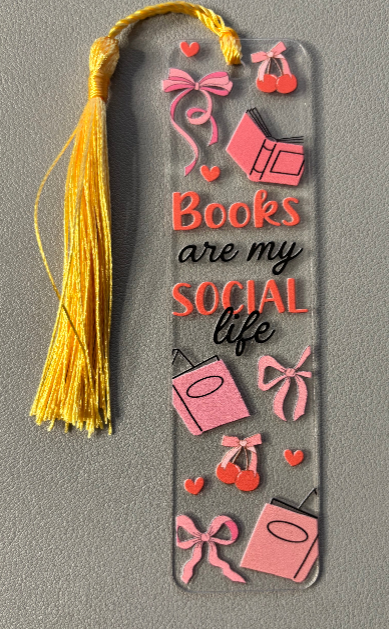 Decorative bookmark with 'Books are my social life' text and pink book illustrations on a gray background.