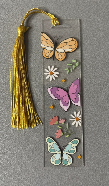 Decorative bookmark with butterflies and flowers on a gray background