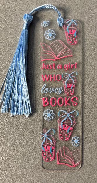 Decorative bookmark with text saying just a girl who loves books and designs on a beige background