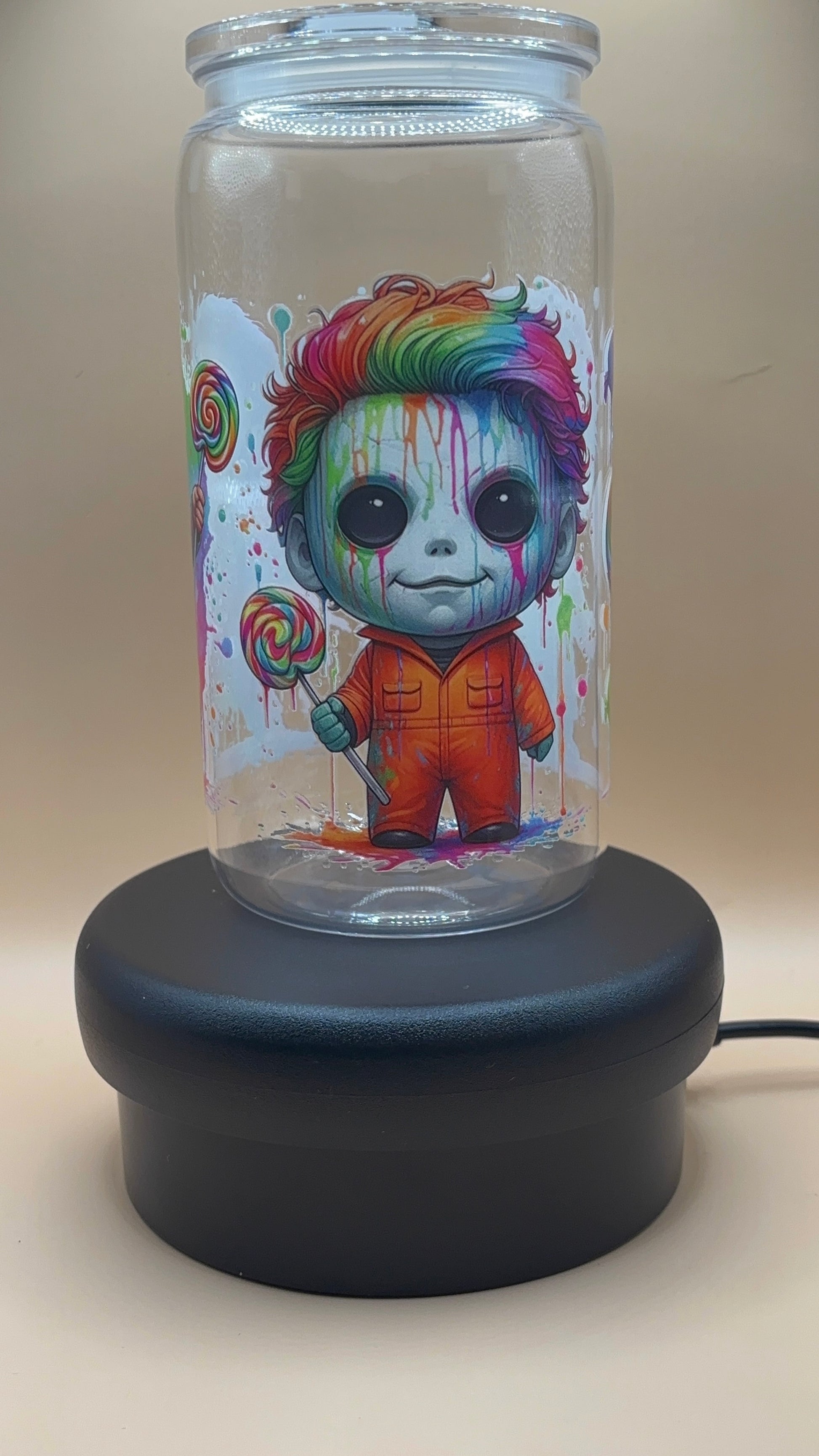Clear plastic tumbler with a colorful michael myers design 