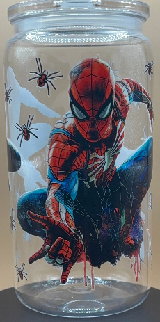 Plastic tumbler with Spider-Man design on a beige background