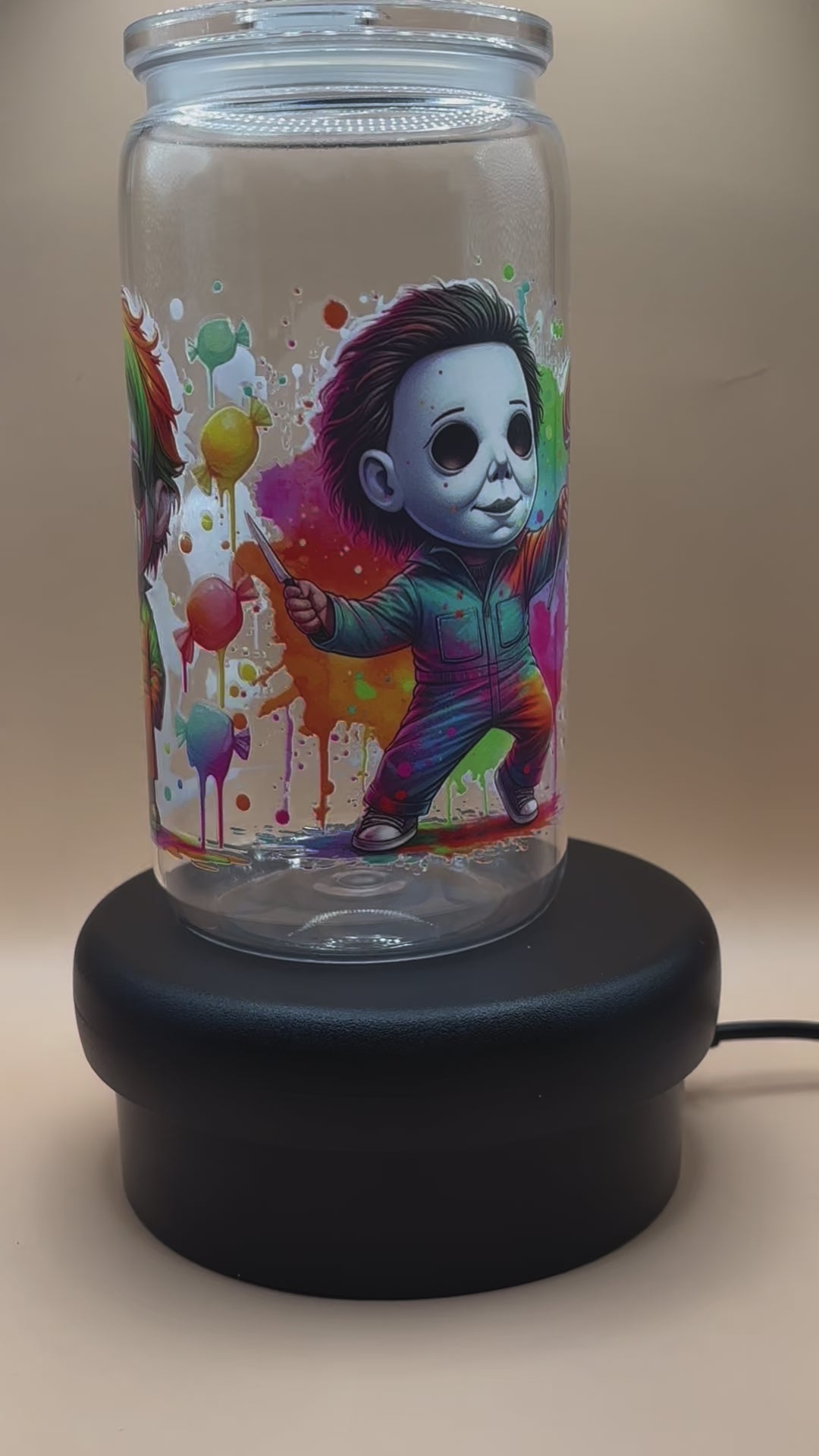 video of Clear plastic tumbler with a colorful michael myers design 