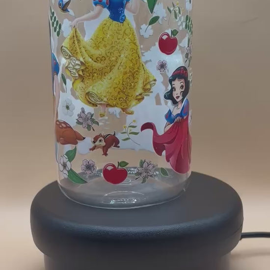 video of Plastic tumbler with Snow White illustration on a beige background