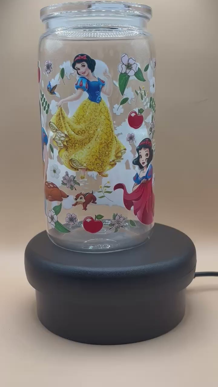 video of Plastic tumbler with Snow White illustration on a beige background